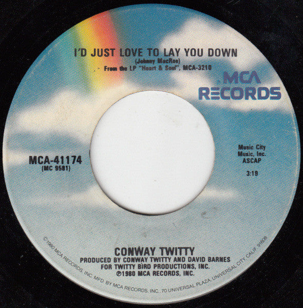 Conway Twitty : She Thinks I Still Care (7", Single, Glo)