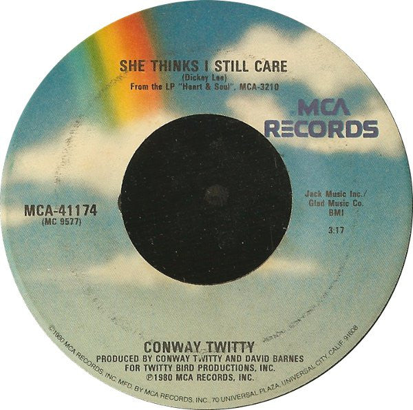 Conway Twitty : She Thinks I Still Care (7", Single, Glo)